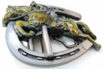  horse belt buckle with jockey jumping a horse shoe